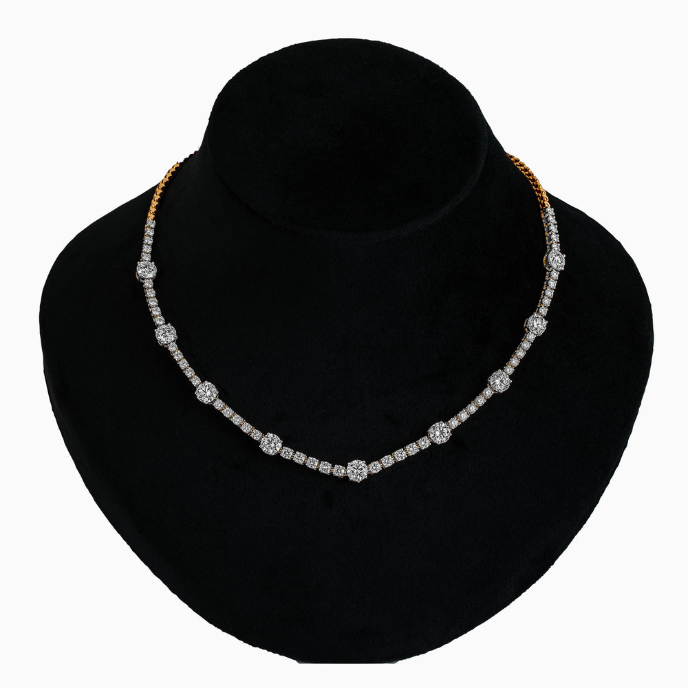 Diamond tennis necklace with gold chain, sparkling on black display bust