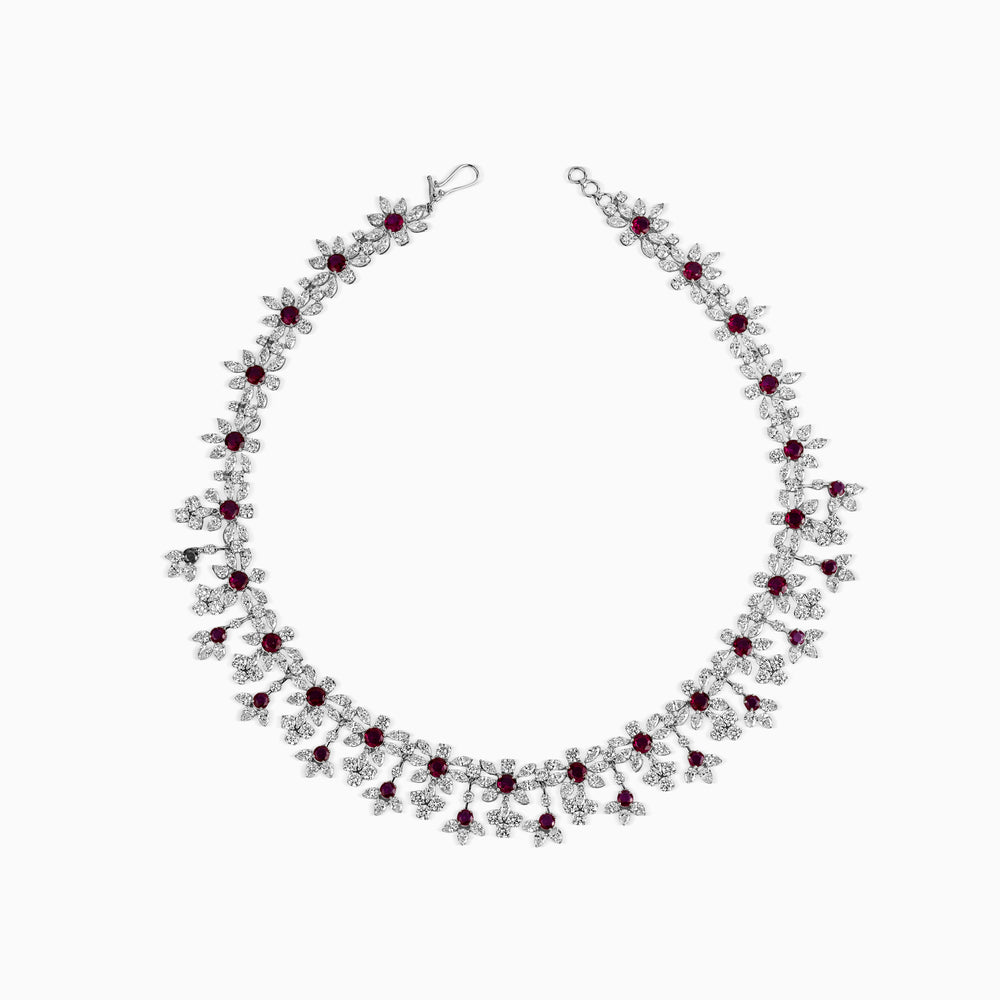 Elegant diamond and ruby flower necklace with intricate floral design