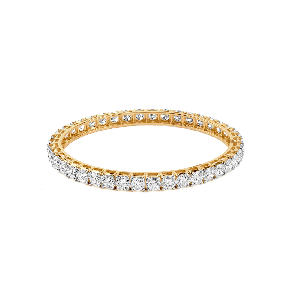 Gold eternity band with diamond-encrusted sides, sparkling with round brilliant stones.