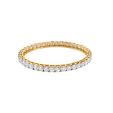 Gold eternity band with diamond-encrusted sides, sparkling with round brilliant stones.