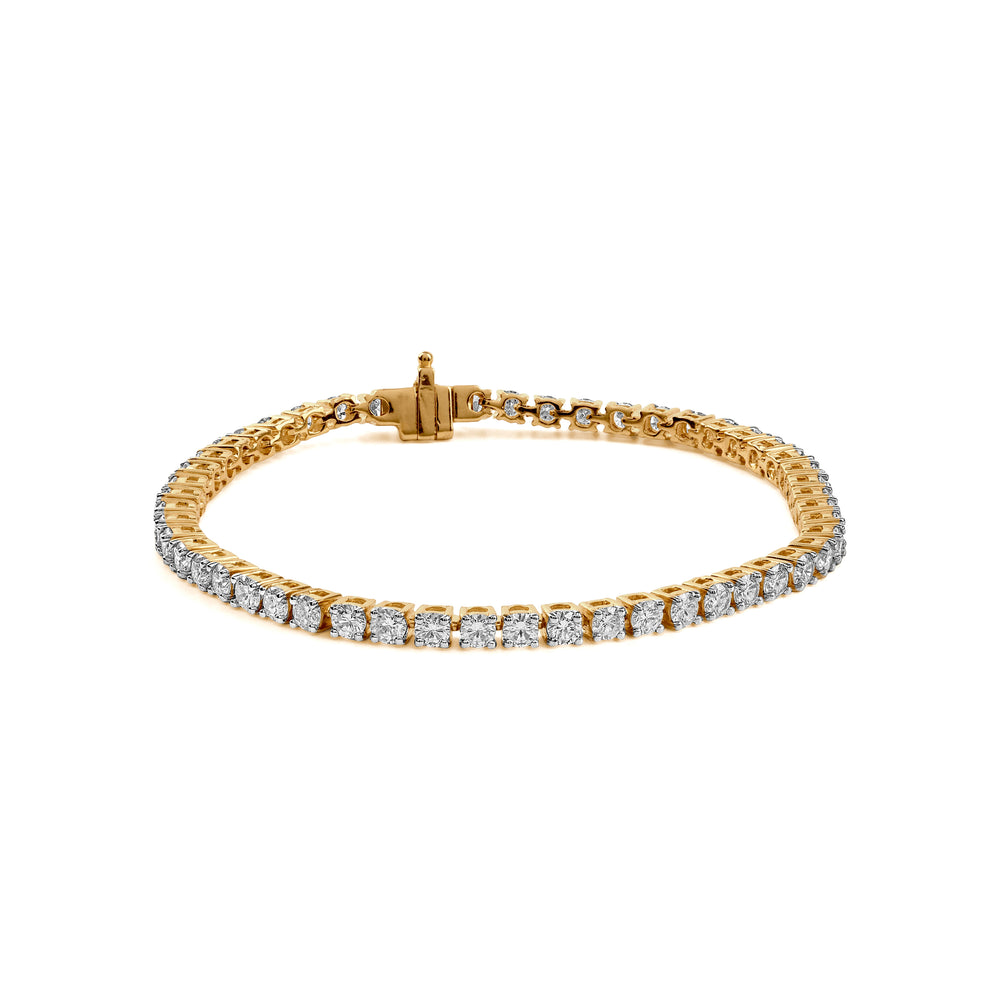 Gold tennis bracelet with diamond stones and secure clasp.