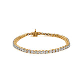Gold tennis bracelet with diamond stones and secure clasp.