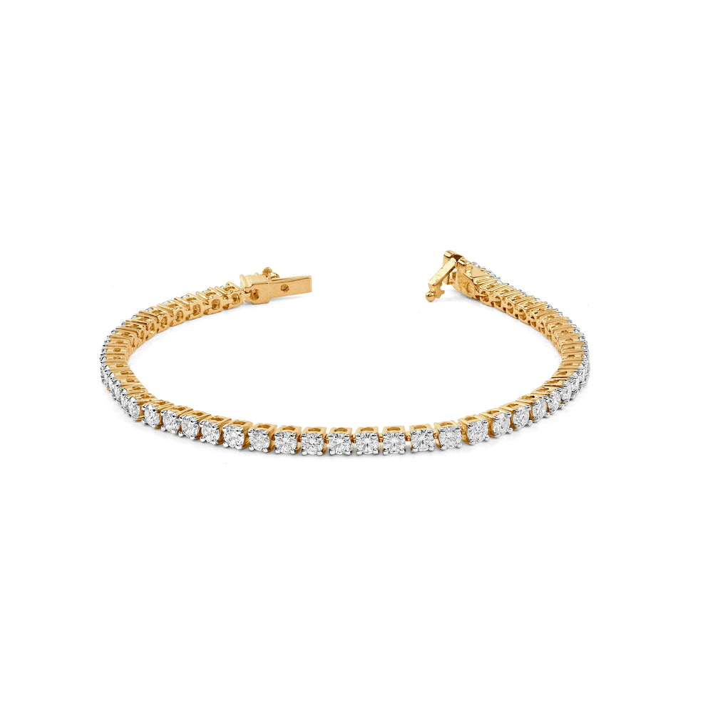 Gold tennis bracelet with diamond-studded links and delicate clasp