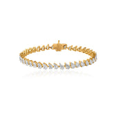 Gold tennis bracelet with pear-cut diamonds in elegant, interconnected design