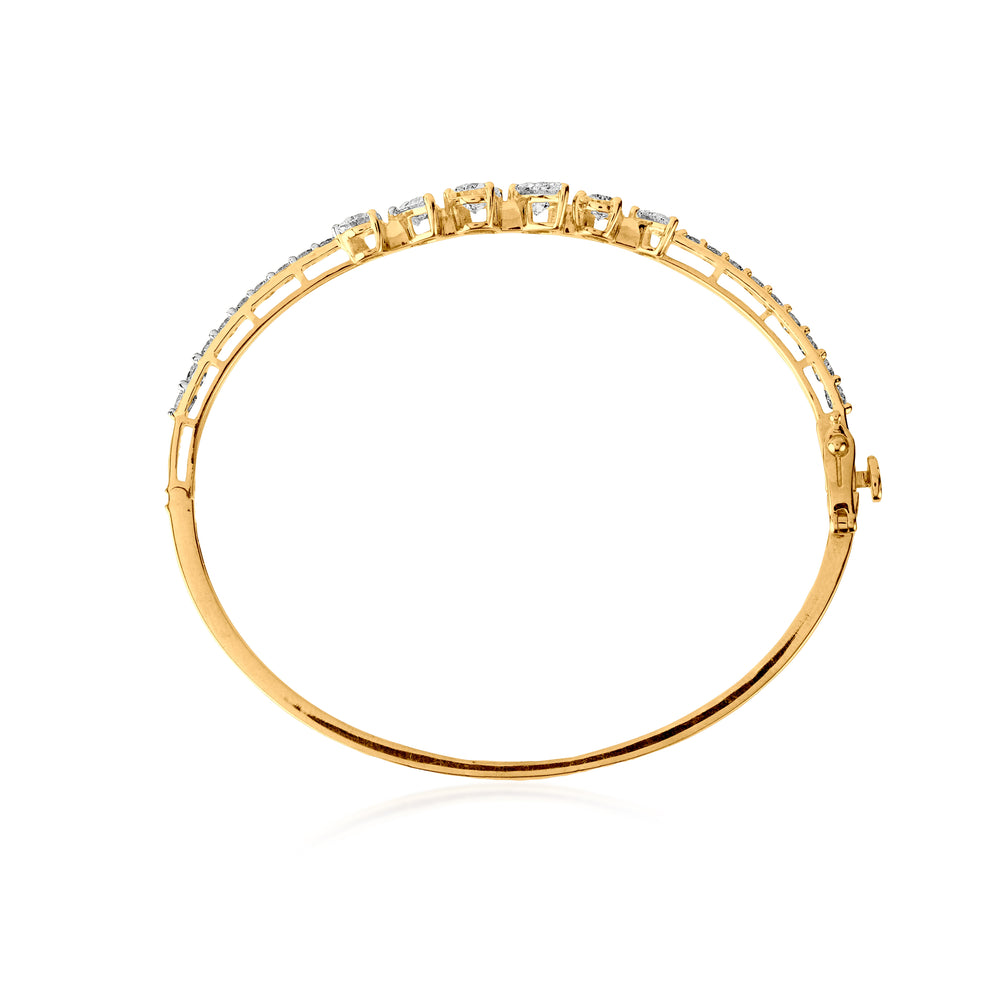 Gold bangle bracelet with diamond clusters and delicate hinged design