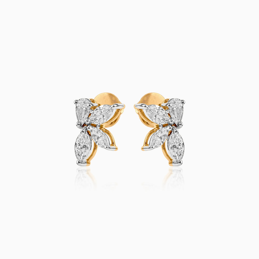 Diamond butterfly stud earrings in gold and white gold with marquise-cut stones
