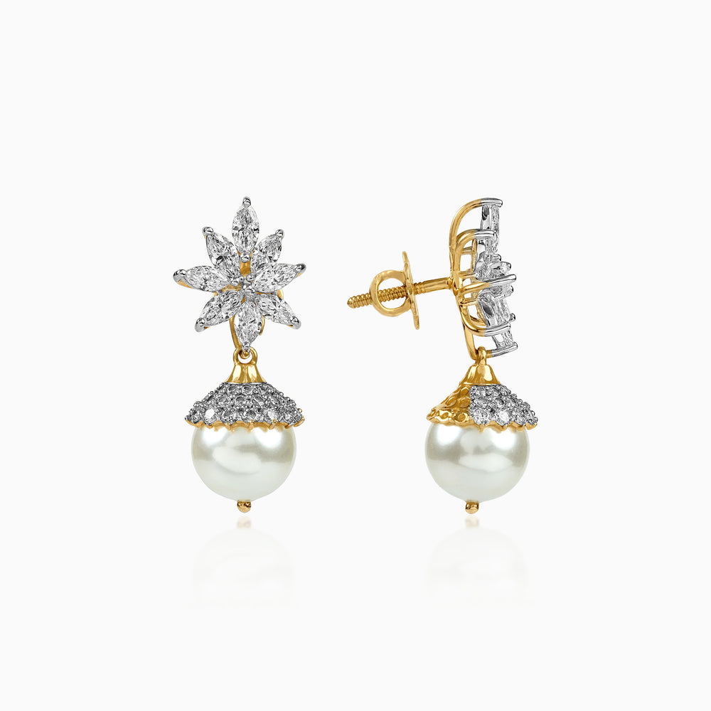 Gold and diamond star earrings with white pearl drops, intricate floral design