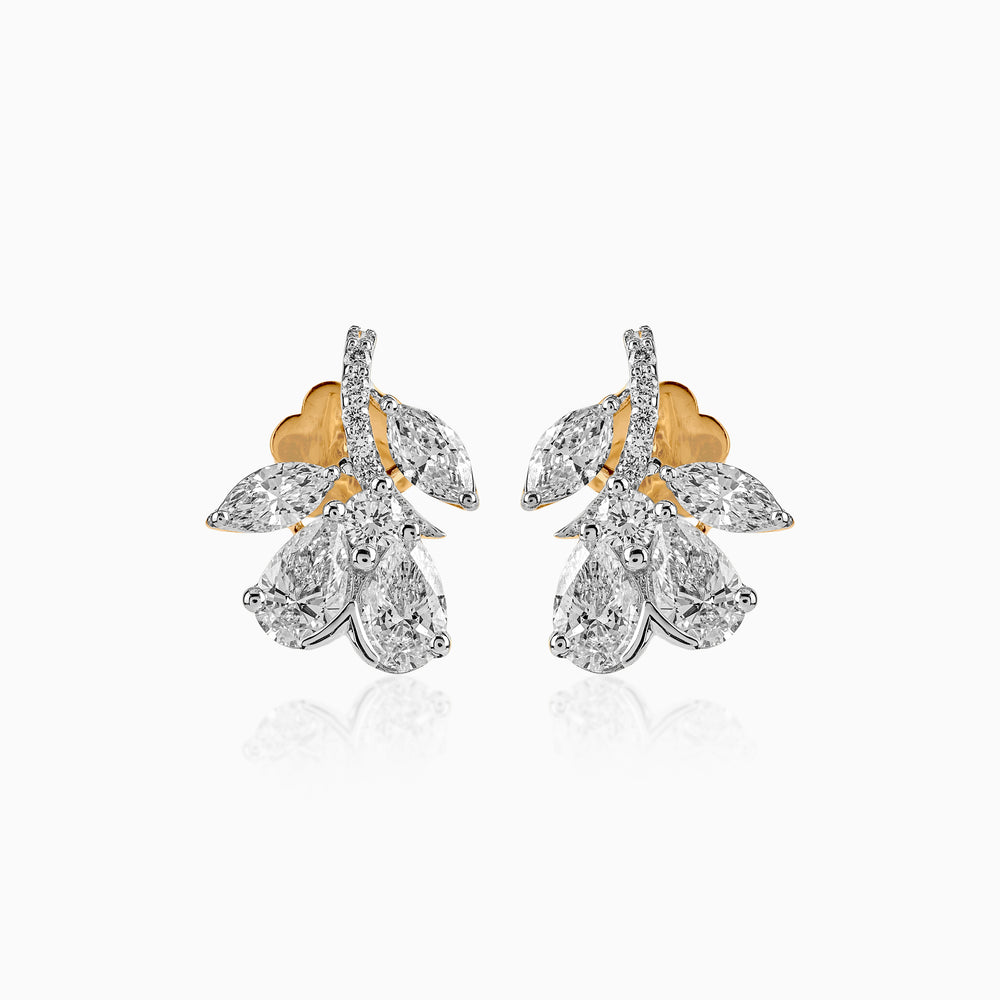 Diamond cluster earrings with gold and silver pear-shaped stones in elegant floral design