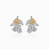 Diamond cluster earrings with gold and silver pear-shaped stones in elegant floral design
