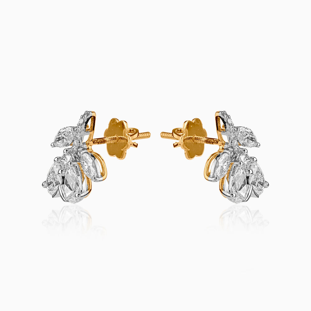 Diamond cluster earrings in gold and white gold with pear-shaped stones and screw-back posts