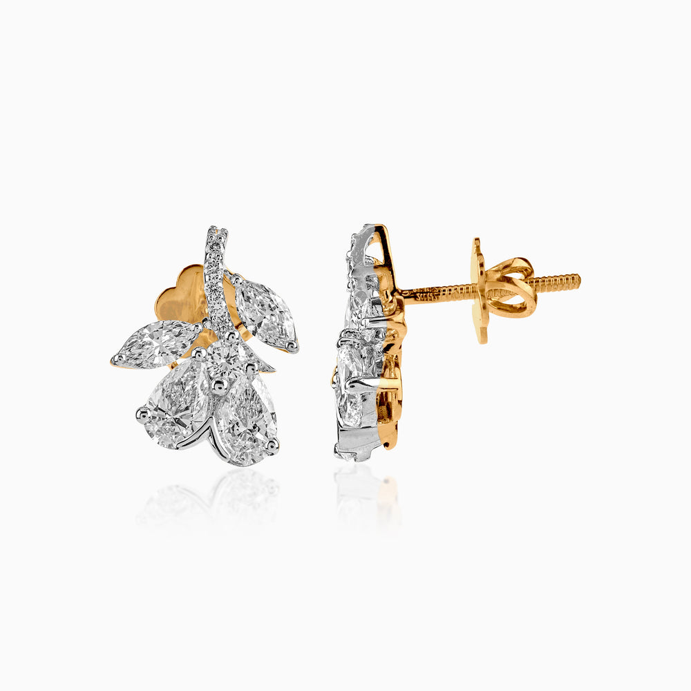 Gold and diamond floral stud earrings with marquise and round brilliant cut stones