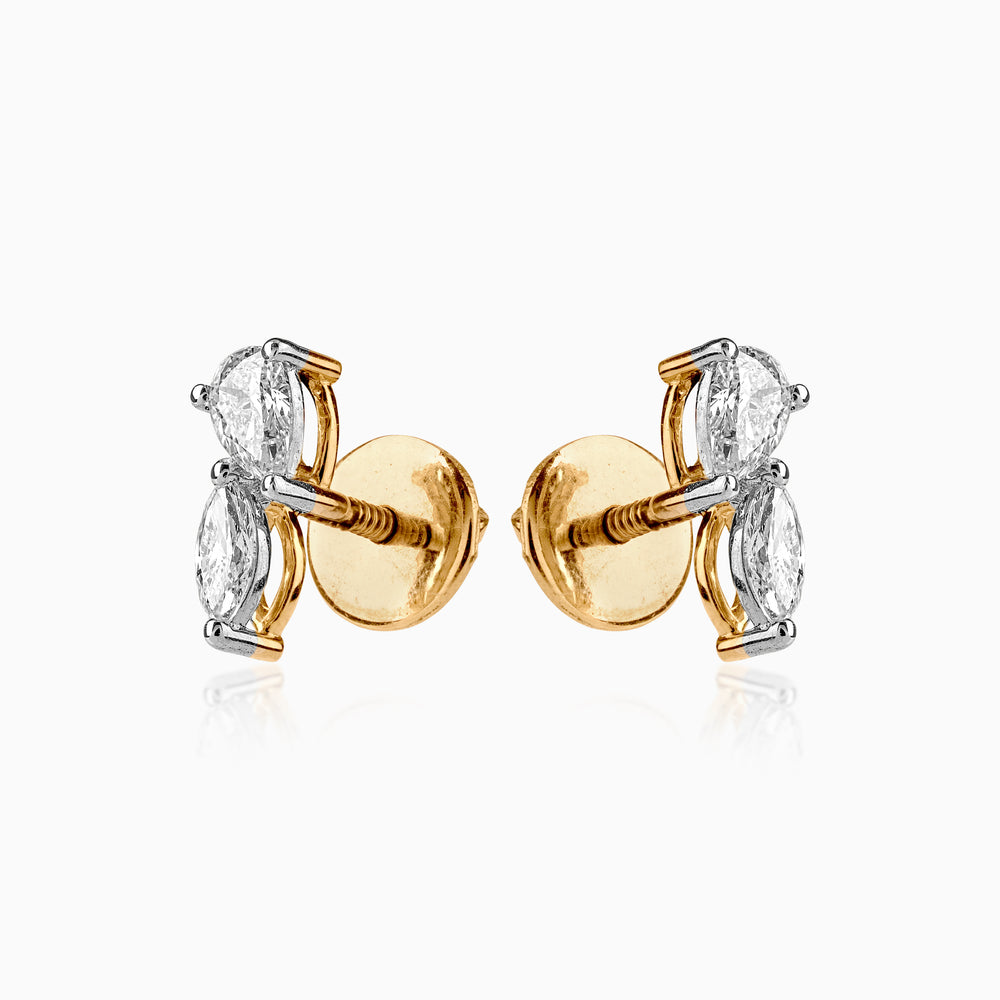 Gold and silver diamond stud earrings with two-stone marquise diamond design