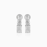 Diamond drop earrings with emerald-cut and round brilliant stones in silver setting
