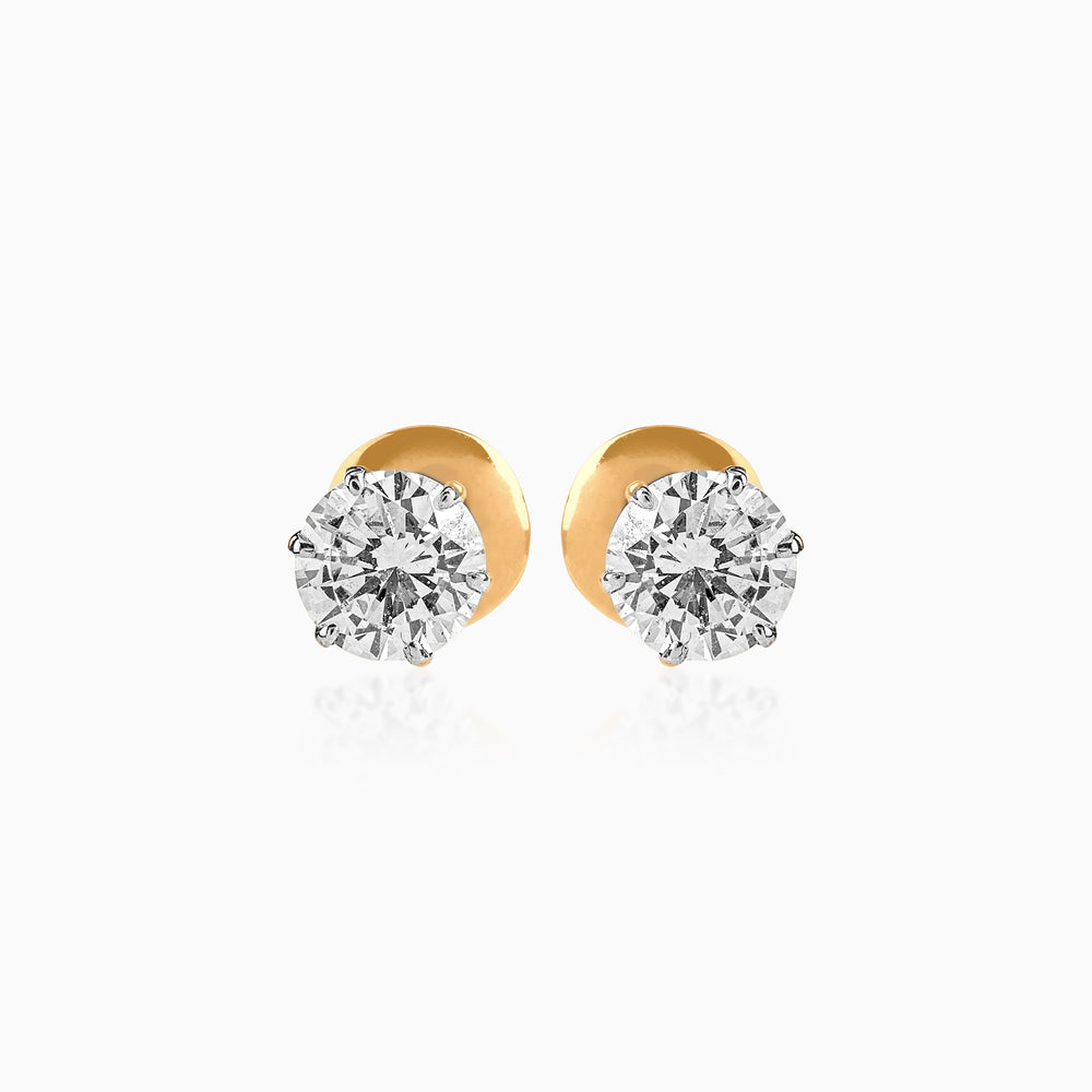 Gold stud earrings with round brilliant diamond solitaires in prong settings