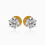 Pair of round diamond stud earrings with gold backs and silver prong settings
