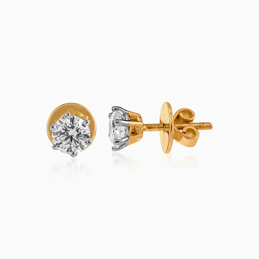 Gold and silver diamond stud earrings with screw-back closures, showcasing round brilliant cut stones.