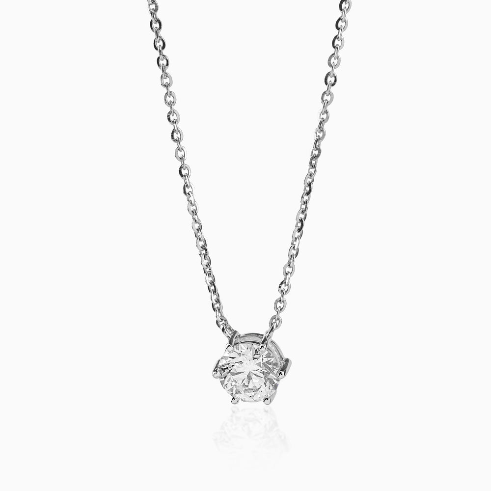 Silver necklace with six-prong round brilliant diamond pendant on delicate chain