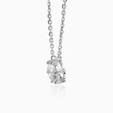 Silver necklace with round diamond pendant in ornate geometric metal setting