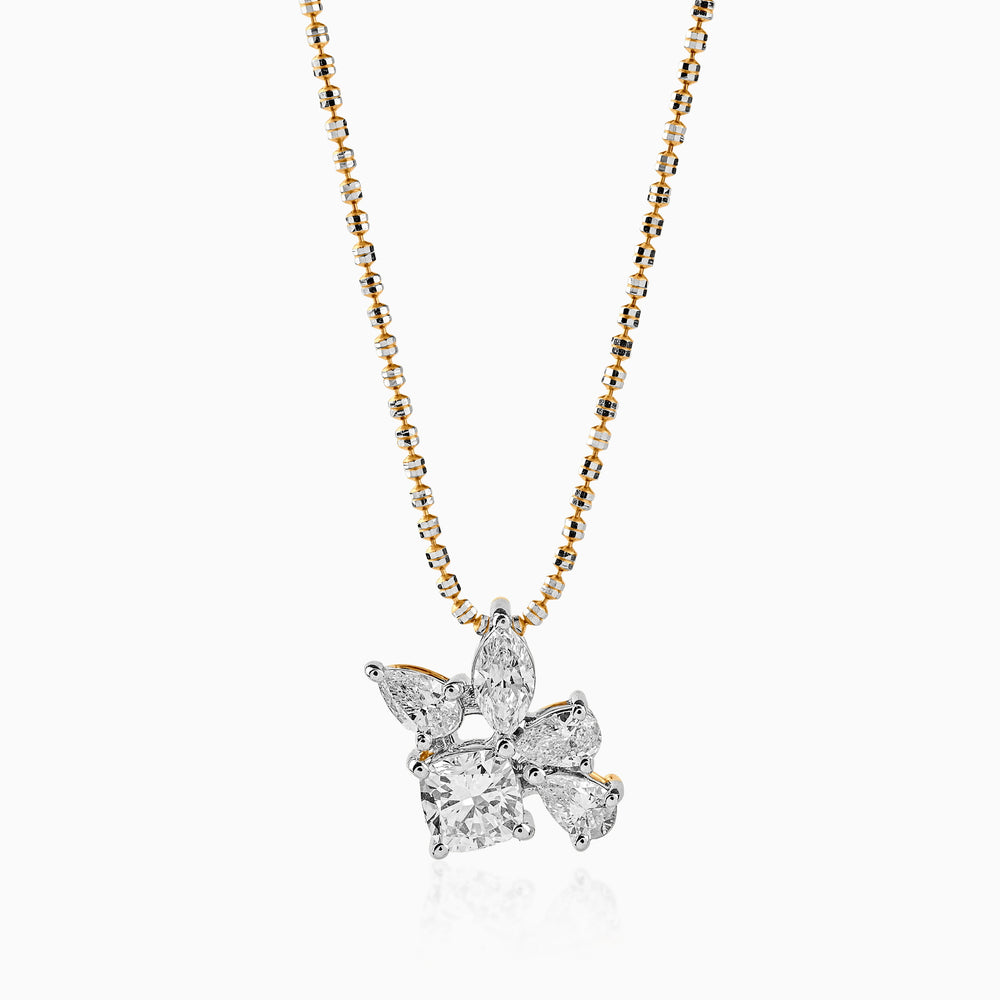 Diamond cluster pendant on two-tone gold and black chain