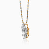 Two-tone diamond pendant on textured silver and gold chain, hanging vertically