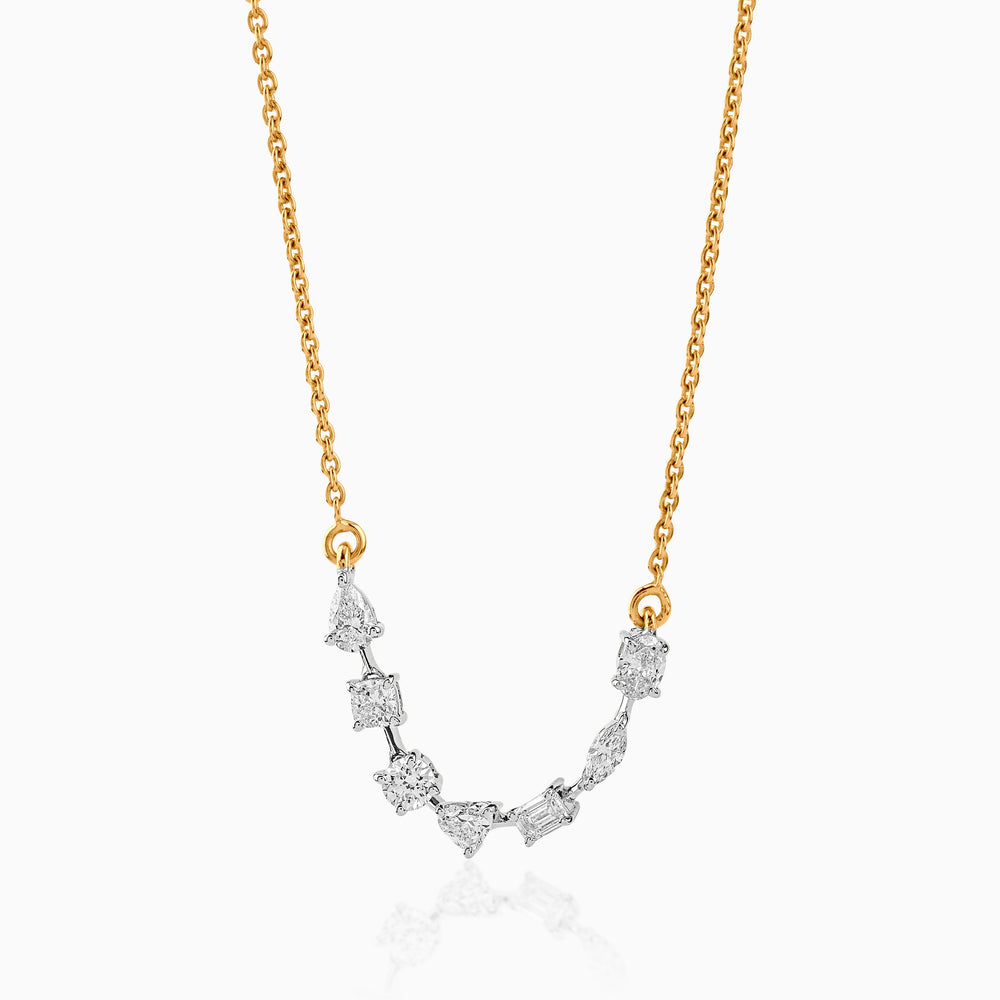Gold chain with multi-cut diamond pendant, featuring unique geometric diamond shapes.