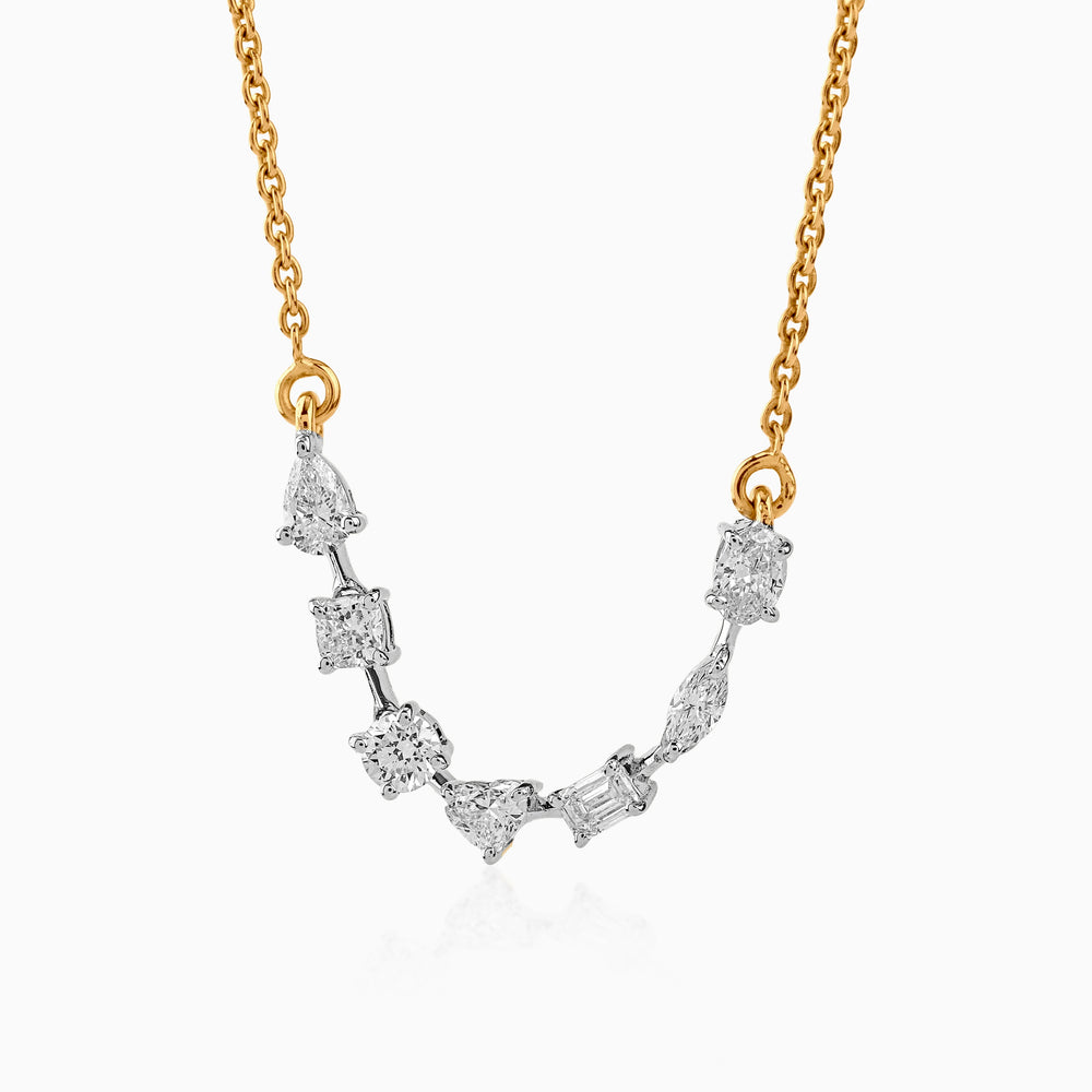 Gold chain with multi-shape diamond pendant in silver, featuring varied diamond cuts and elegant design.