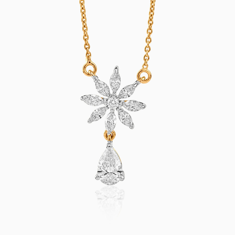 Diamond flower pendant with teardrop gem on gold chain, delicate and sparkling