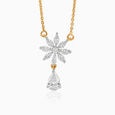 Diamond flower pendant with teardrop gem on gold chain, delicate and sparkling