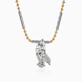 Two-tone gold and silver necklace with marquise and round diamond pendant on twisted chain