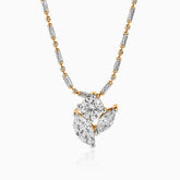 Diamond pendant with mixed metal chain, clusters of white and gold gems