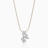 Gold and silver chain with multi-diamond clustered pendant in pear and round brilliant cuts.