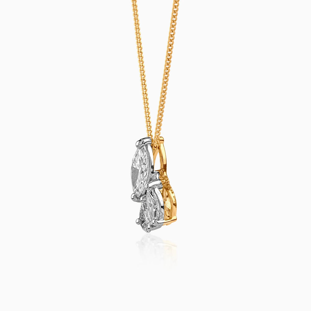 Gold and silver pendant with two marquise-cut diamonds on delicate chain