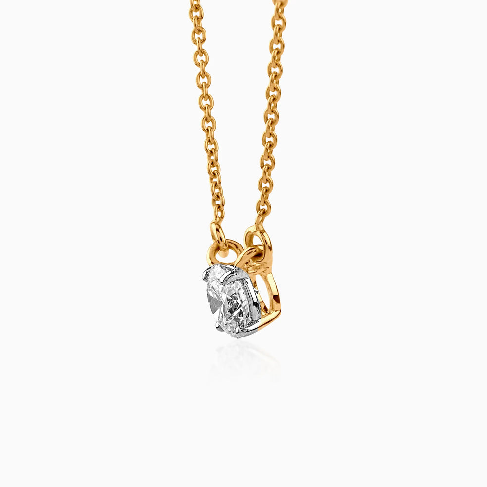 Gold necklace with solitaire diamond pendant, delicate chain and sparkling clear gemstone