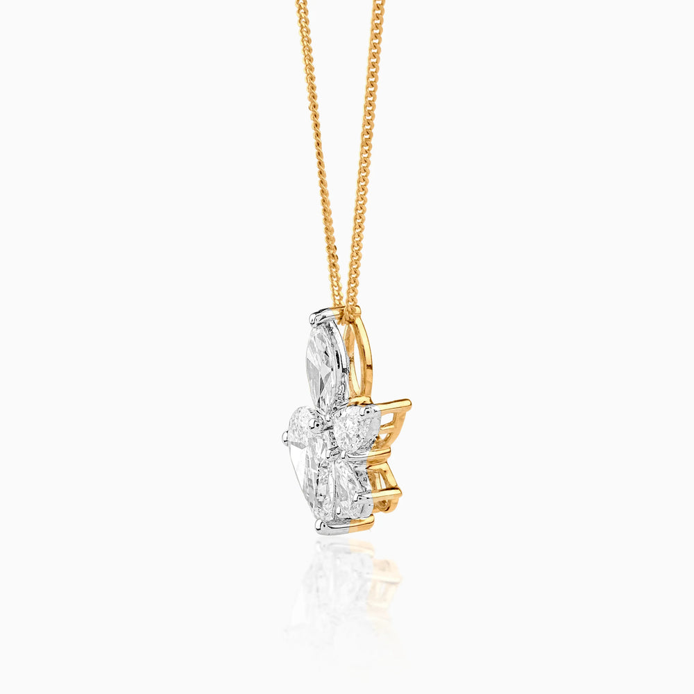 Gold chain with diamond flower pendant in white and yellow gold
