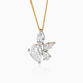 Diamond butterfly pendant on gold chain with multiple teardrop-shaped stones