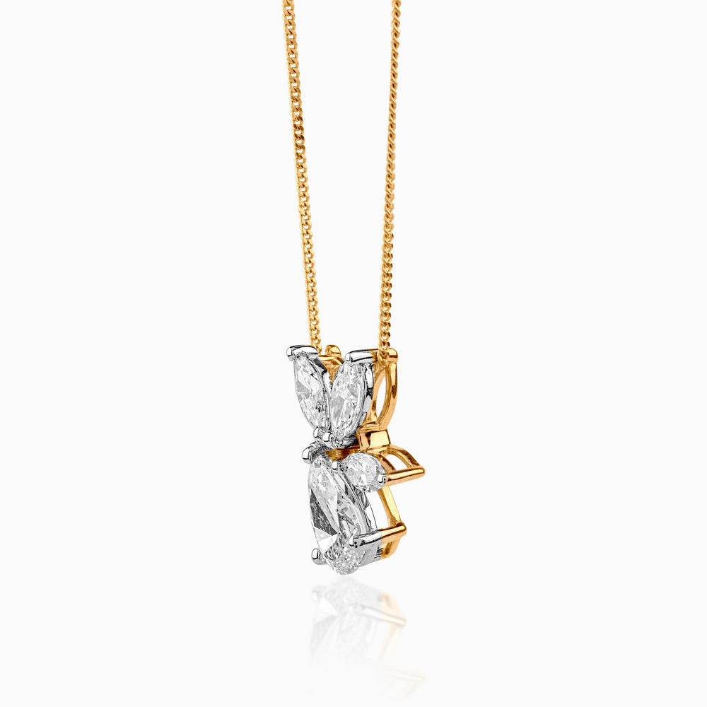 Diamond butterfly pendant on gold chain, white gemstones set in delicate wings