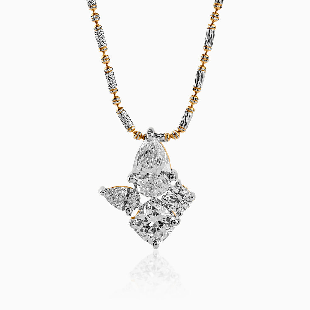 Elegant diamond pendant with mixed metal chain, multiple diamond shapes clustered together