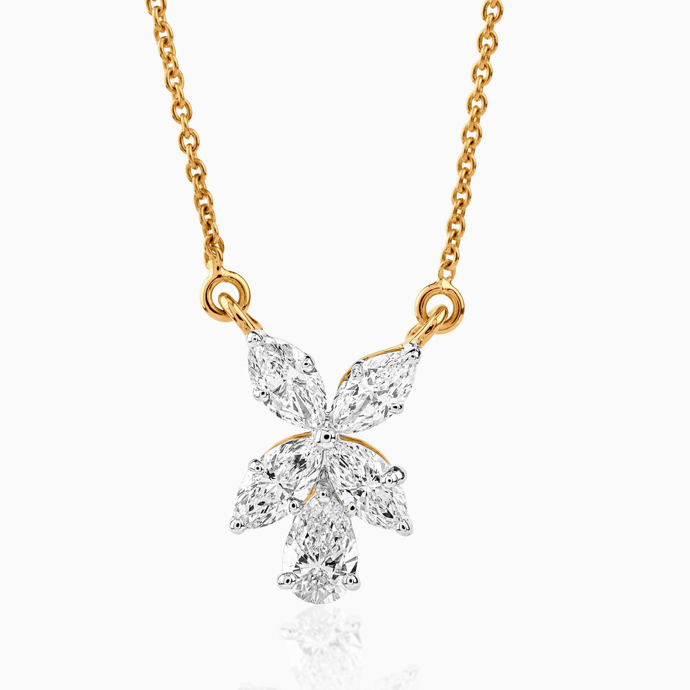 Gold necklace with diamond butterfly pendant, delicate marquise and round stones arranged in wing shape.