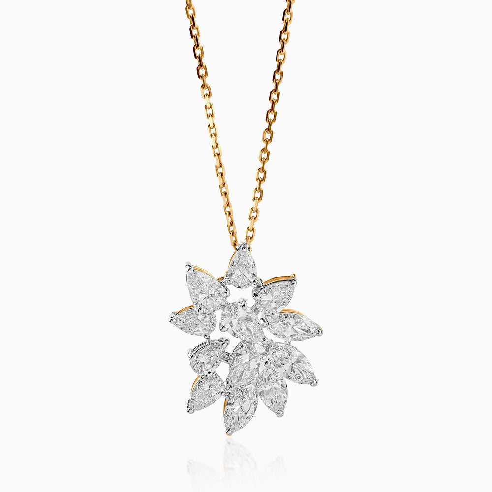 Diamond flower pendant on gold chain, sparkling with marquise-cut stones