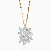Diamond flower pendant on gold chain, sparkling with marquise-cut stones