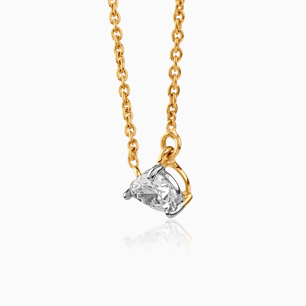 Gold chain necklace with single round diamond pendant in silver and gold setting