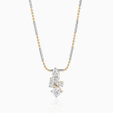 Two-tone necklace with multi-cut diamond pendant on mixed metal chain with gold and silver tones.