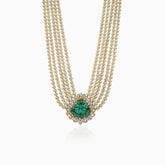 Multi-strand pearl necklace with emerald pendant surrounded by diamond halo