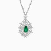Diamond necklace with emerald teardrop pendant surrounded by floral diamond design