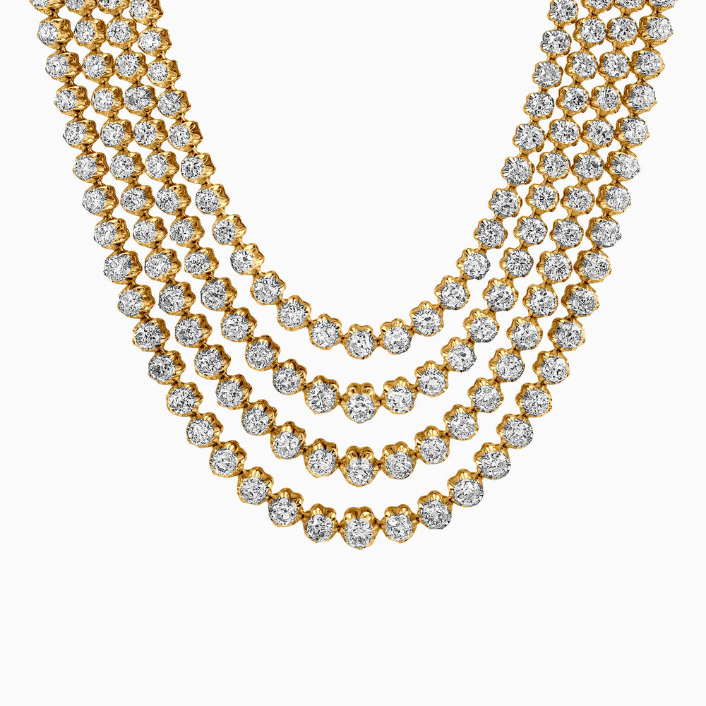 Layered gold diamond necklace with multiple cascading rows of sparkling gems