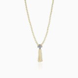 Pearl necklace with diamond-like pendant and delicate tassel design