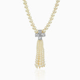 Pearl necklace with diamond cross pendant and cascading pearl tassel