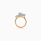 Gold ring with three emerald-cut diamond clusters on white background