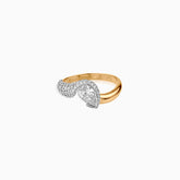 Gold ring with pear-shaped diamond and pavé diamond accent in white gold setting