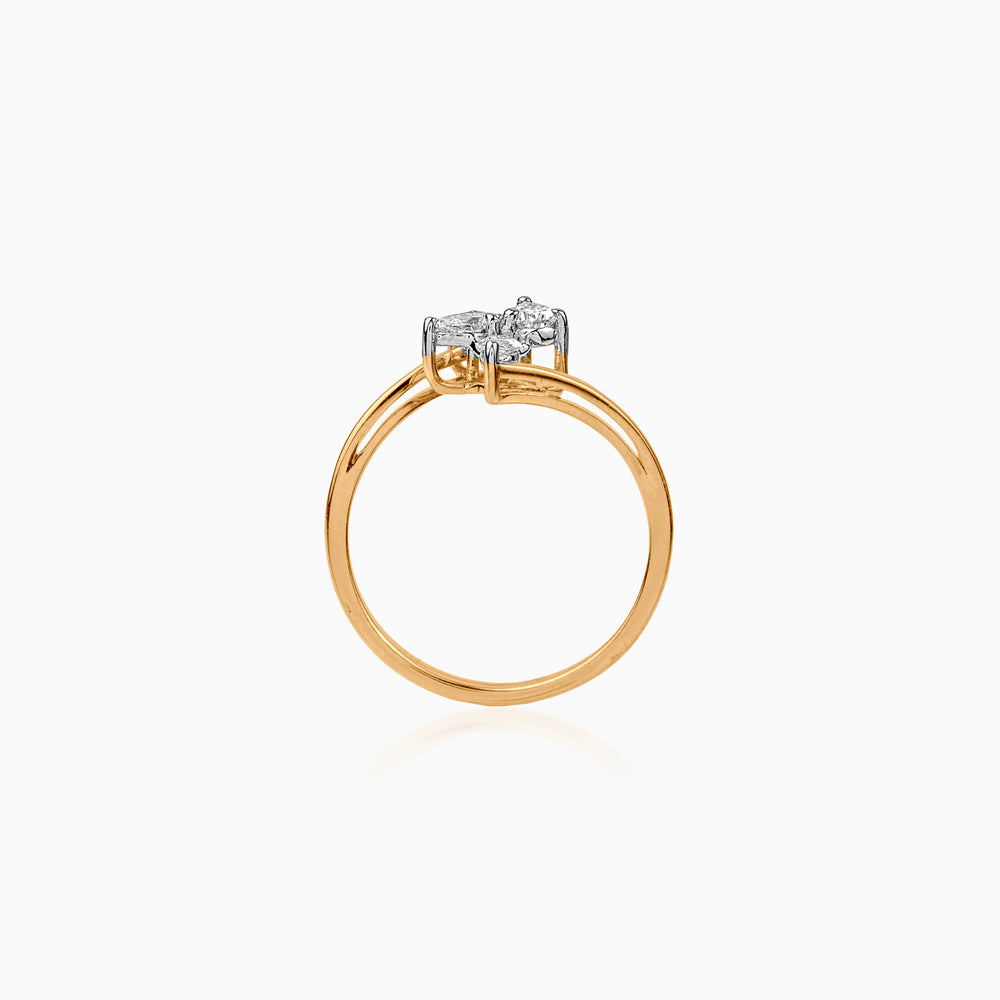 Gold ring with three clustered white diamonds on a delicate band